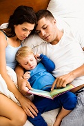 A family reading a book together