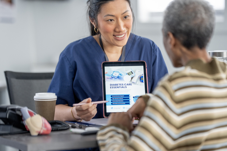 Nurse assisting patient with diabetes