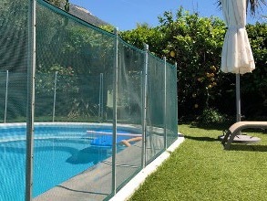 Pool barrier installed around the perimeter of pool area