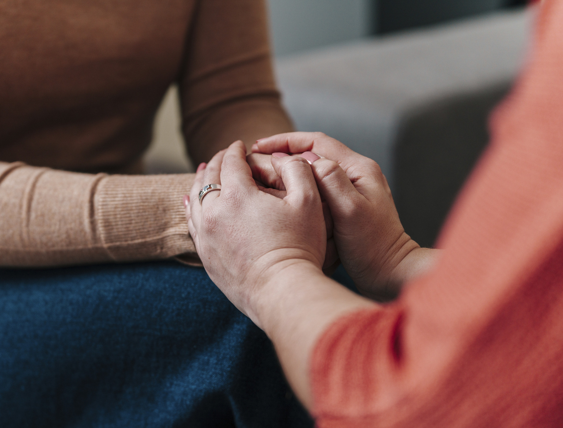Supportive gesture with hands holding